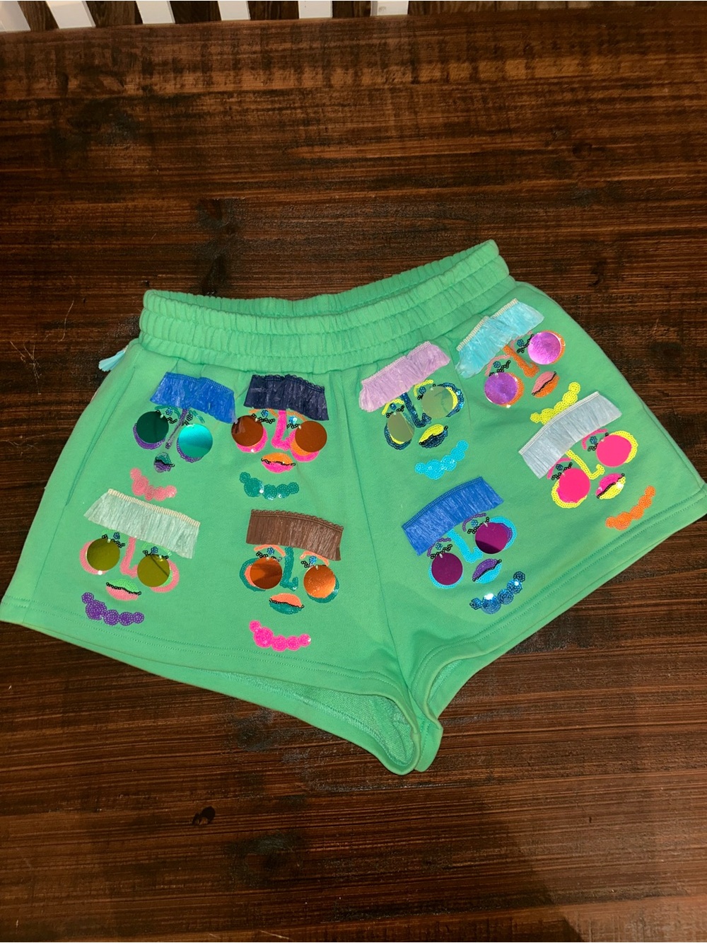 Queen of Sparkles Women’s Green Embellished Face-Graphic Shorts